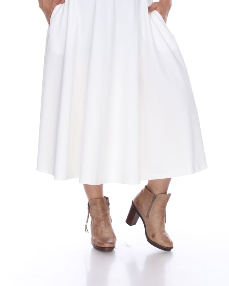 Front of a model wearing a size 3X Tasmin Flare Midi Skirt in White by White Mark. | dia_product_style_image_id:249177